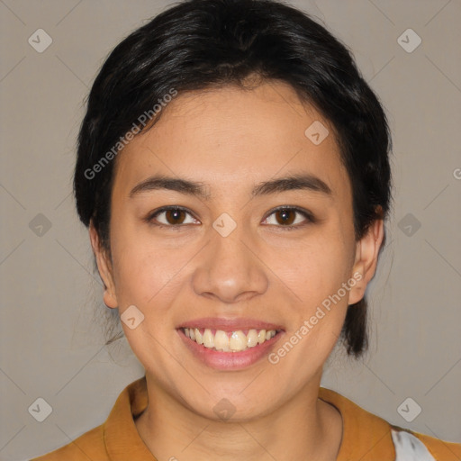 Joyful latino young-adult female with medium  brown hair and brown eyes