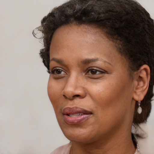 Neutral black young-adult female with short  brown hair and brown eyes