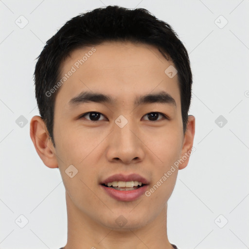 Joyful asian young-adult male with short  black hair and brown eyes