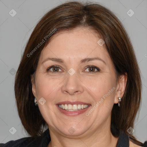 Joyful white adult female with medium  brown hair and brown eyes