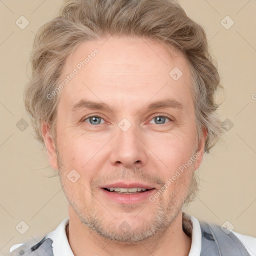 Joyful white adult male with short  brown hair and grey eyes