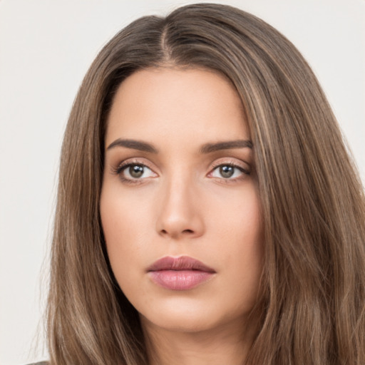 Neutral white young-adult female with long  brown hair and brown eyes