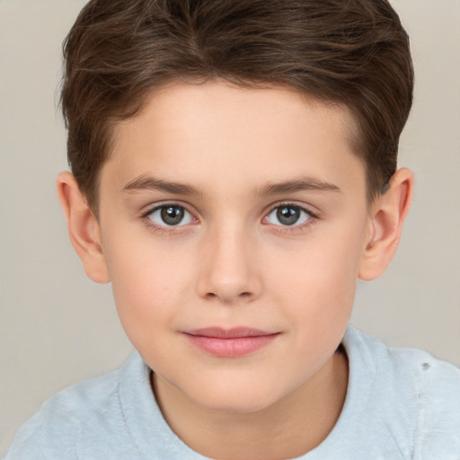 Joyful white child female with short  brown hair and brown eyes