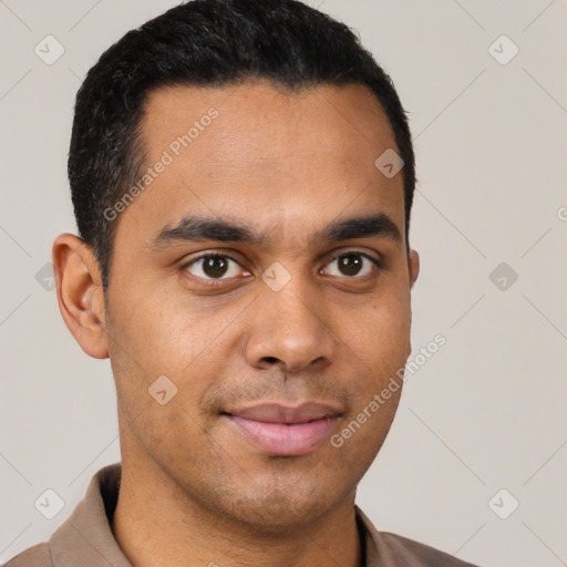 Joyful latino young-adult male with short  black hair and brown eyes