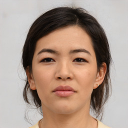 Neutral asian young-adult female with medium  brown hair and brown eyes