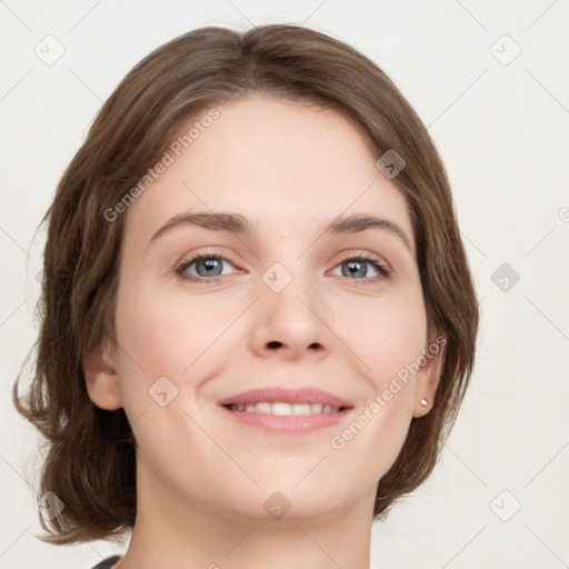 Joyful white young-adult female with medium  brown hair and green eyes