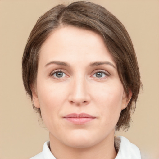 Joyful white young-adult female with medium  brown hair and green eyes