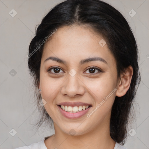 Joyful white young-adult female with medium  brown hair and brown eyes