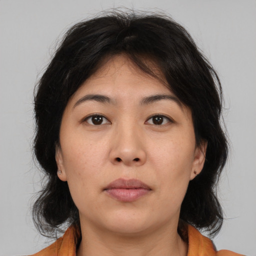Neutral asian young-adult female with medium  brown hair and brown eyes
