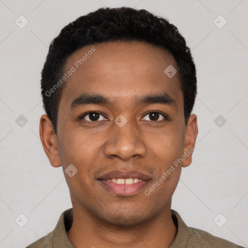 Joyful black young-adult male with short  black hair and brown eyes