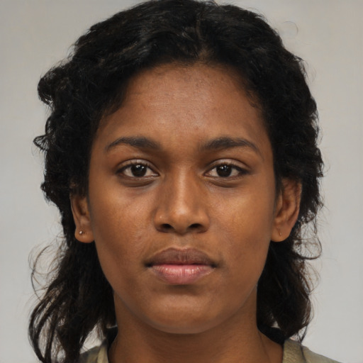 Neutral black young-adult female with medium  brown hair and brown eyes