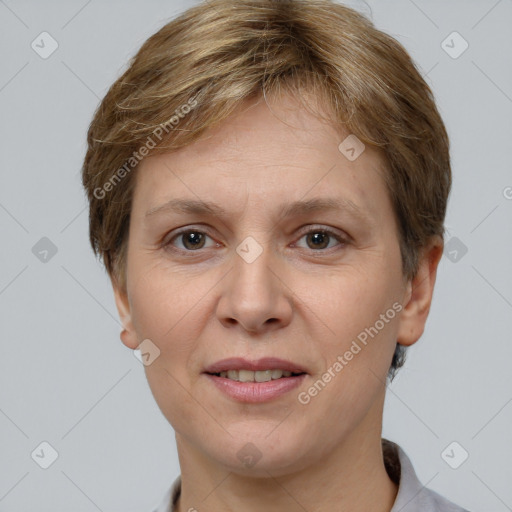 Joyful white adult female with short  brown hair and grey eyes