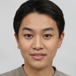 Joyful asian young-adult male with short  black hair and brown eyes