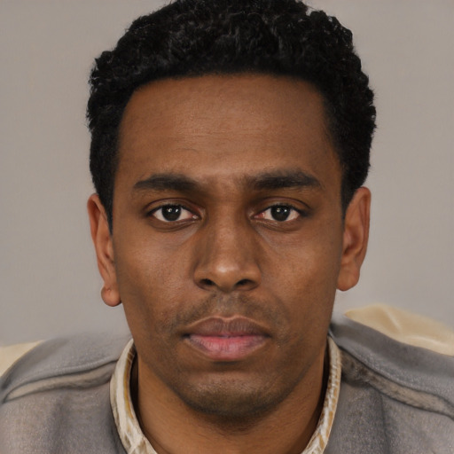Neutral black young-adult male with short  black hair and brown eyes