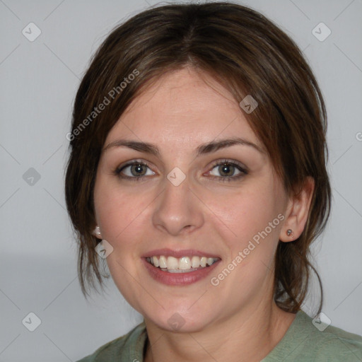 Joyful white young-adult female with medium  brown hair and blue eyes