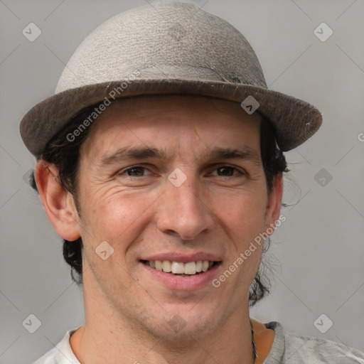 Joyful white adult male with short  brown hair and grey eyes