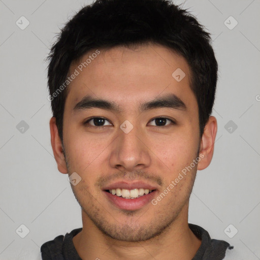 Joyful asian young-adult male with short  brown hair and brown eyes