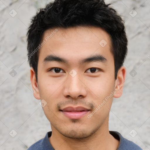 Joyful asian young-adult male with short  black hair and brown eyes