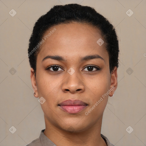 Joyful black young-adult female with short  black hair and brown eyes