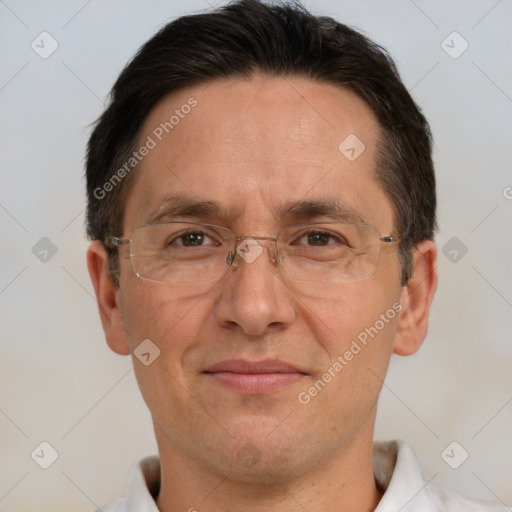 Joyful white adult male with short  brown hair and brown eyes