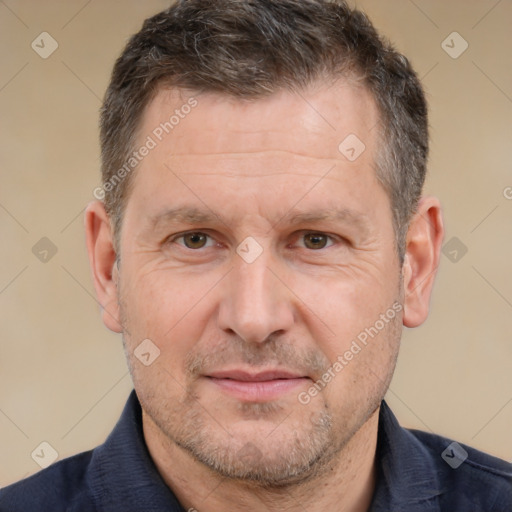 Joyful white adult male with short  brown hair and brown eyes