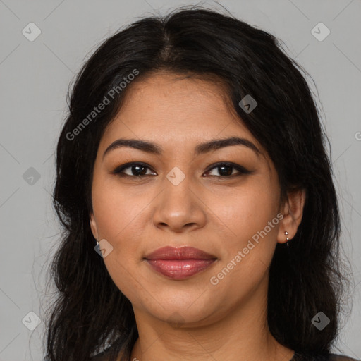 Joyful latino young-adult female with long  brown hair and brown eyes