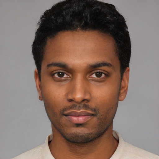 Neutral latino young-adult male with short  black hair and brown eyes