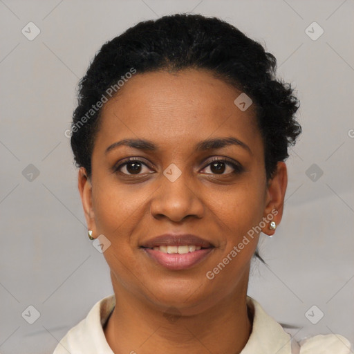 Joyful black young-adult female with short  black hair and brown eyes