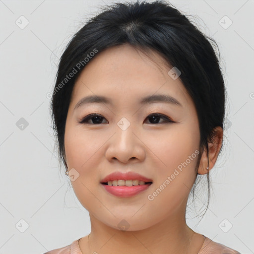 Joyful asian young-adult female with medium  black hair and brown eyes