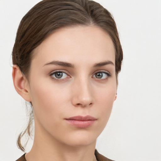 Neutral white young-adult female with short  brown hair and brown eyes