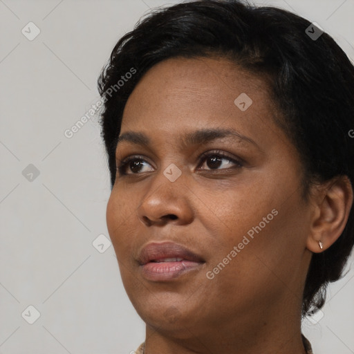 Neutral black young-adult female with short  black hair and brown eyes