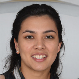 Joyful white young-adult female with medium  brown hair and brown eyes