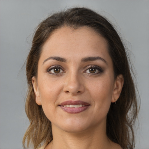 Joyful white young-adult female with medium  brown hair and brown eyes