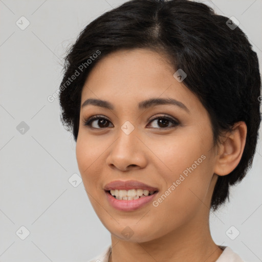 Joyful latino young-adult female with medium  brown hair and brown eyes