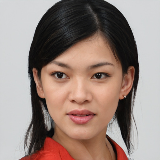 Joyful asian young-adult female with medium  black hair and brown eyes
