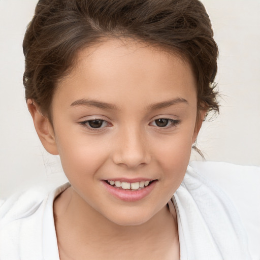 Joyful white child female with short  brown hair and brown eyes