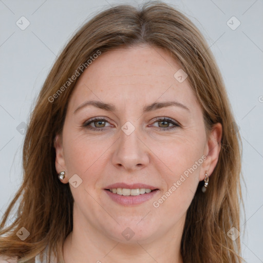 Joyful white adult female with long  brown hair and brown eyes