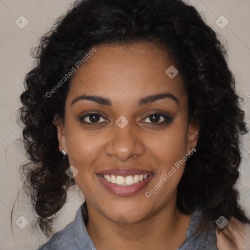 Joyful black young-adult female with long  brown hair and brown eyes