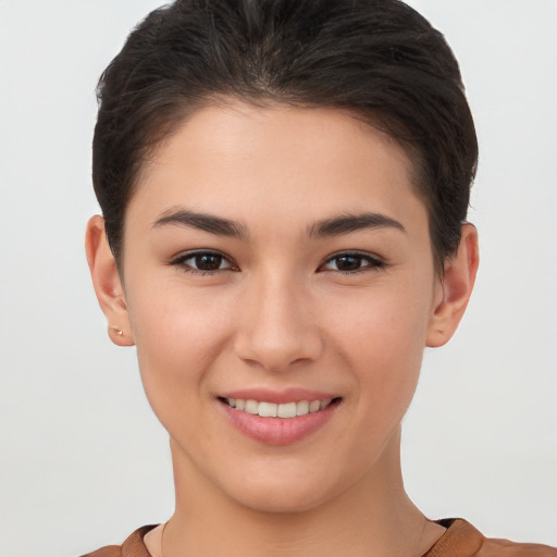 Joyful white young-adult female with short  brown hair and brown eyes