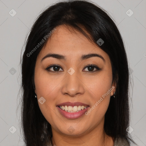 Joyful latino young-adult female with long  brown hair and brown eyes