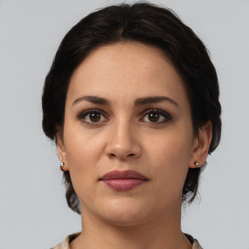 Joyful white young-adult female with medium  brown hair and brown eyes
