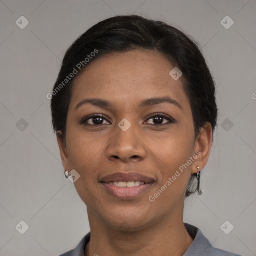 Joyful black young-adult female with medium  black hair and brown eyes