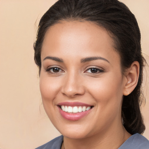 Joyful white young-adult female with long  brown hair and brown eyes