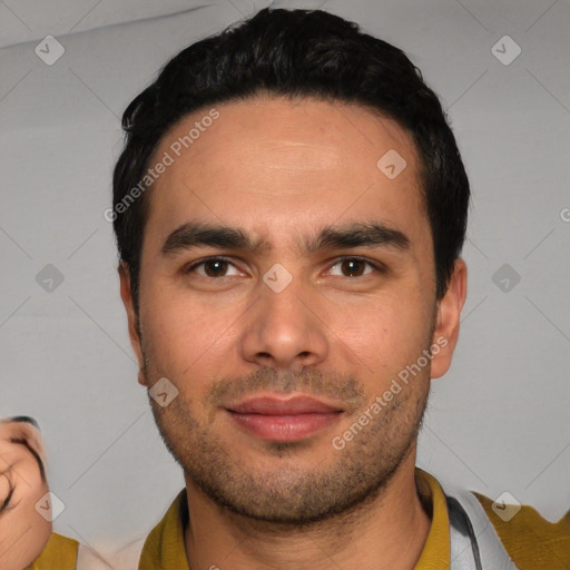 Joyful white young-adult male with short  black hair and brown eyes