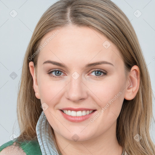 Joyful white young-adult female with long  brown hair and blue eyes