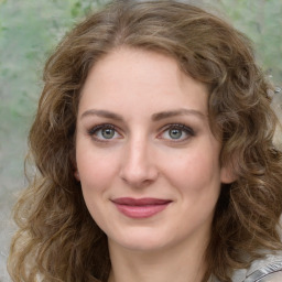 Joyful white young-adult female with medium  brown hair and green eyes