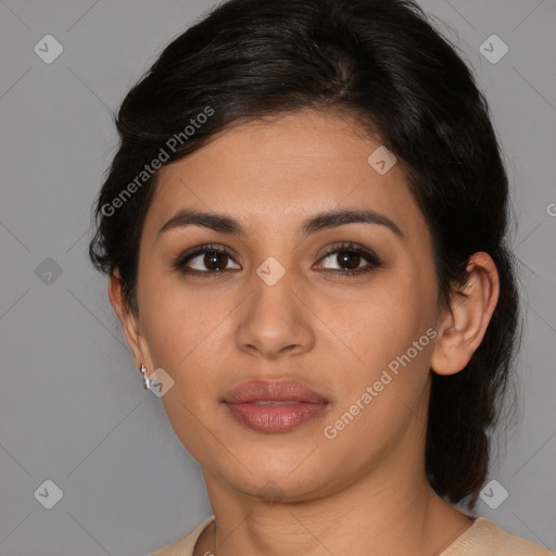 Joyful latino young-adult female with medium  brown hair and brown eyes