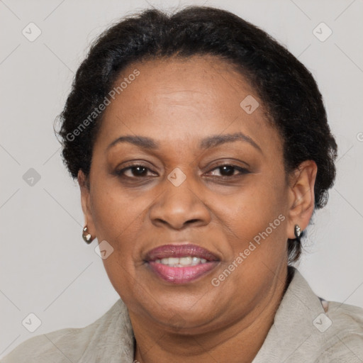 Joyful black adult female with short  brown hair and brown eyes