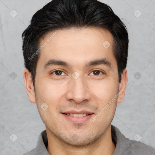 Joyful white young-adult male with short  black hair and brown eyes