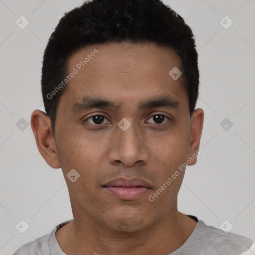 Neutral latino young-adult male with short  black hair and brown eyes